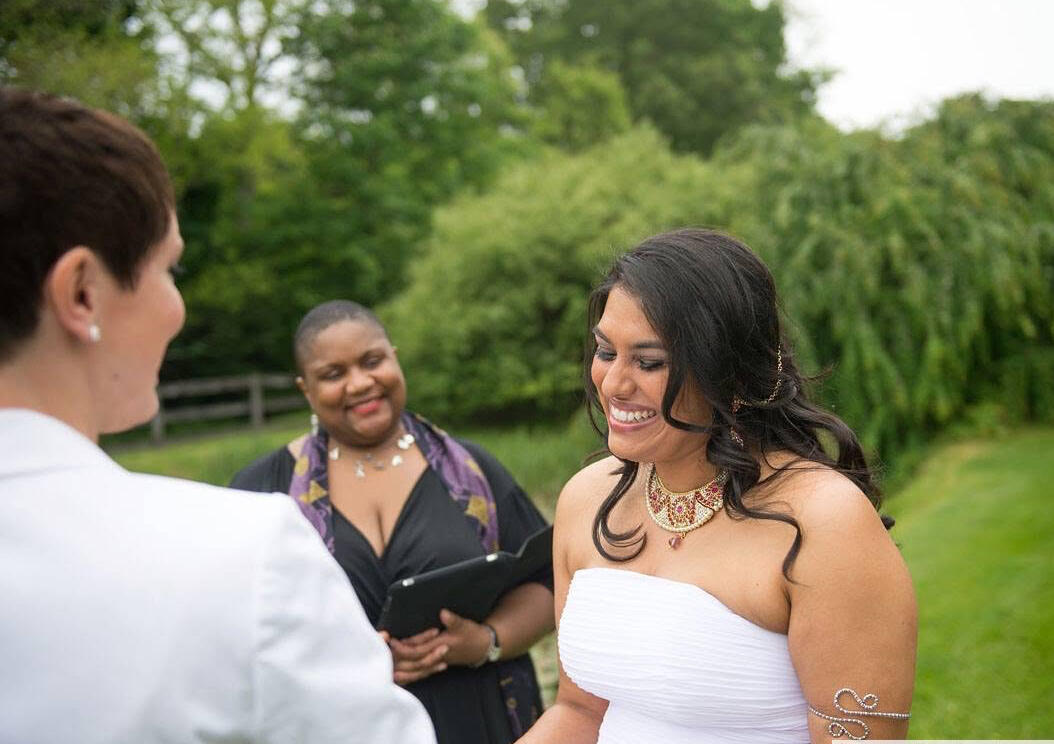 Nikki and smiling bride, Ann Officiant, Nikki, smiles with a beautiful smiling bride on her wedding day